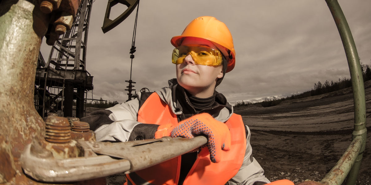 A woman works on an oil drilling platform
